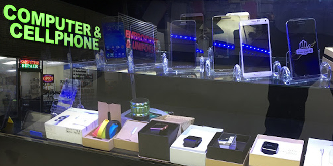 Phones for sale at the Computer & Cellphone storefront on West Main St in Lewisville, TX